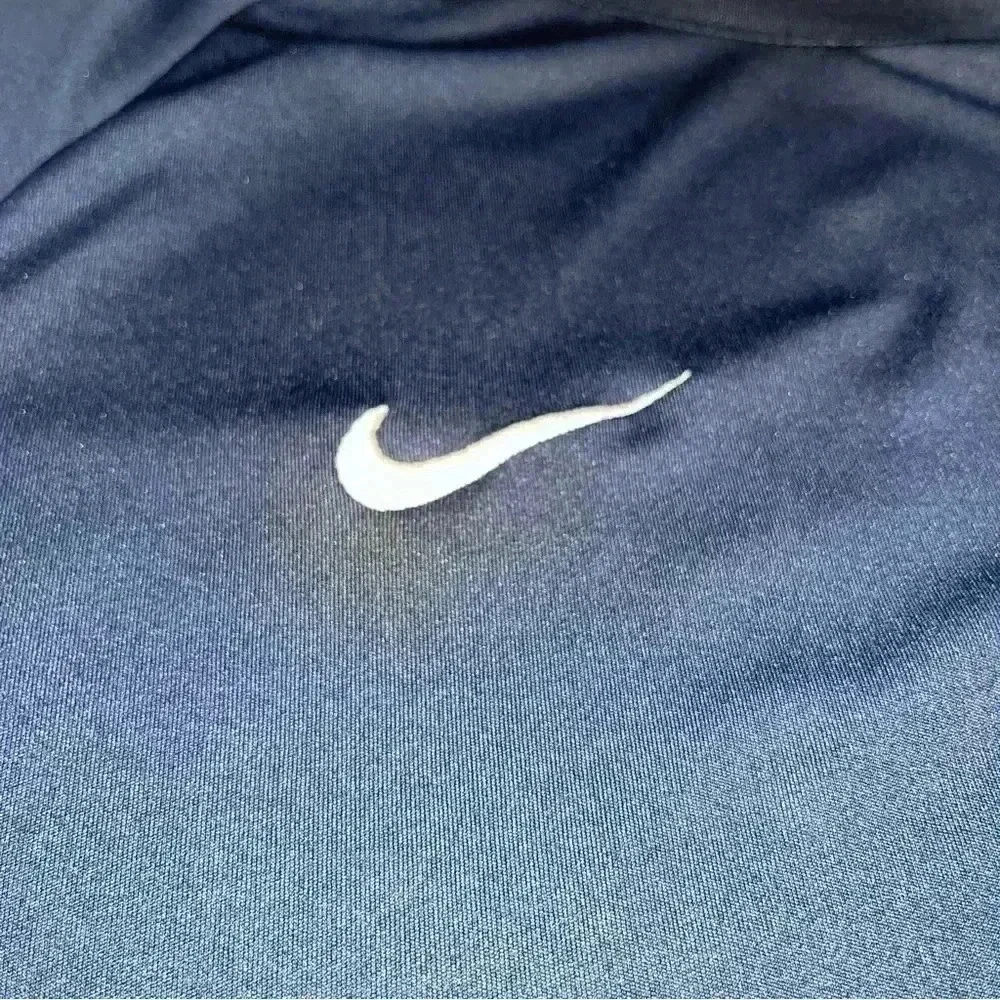 Nike Dri fit vented sides shirt sleeve shirt with Nike emblem on chest